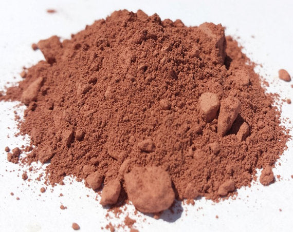 Australian Pastel Pink Clay mask by Yellow Poppy for stressed, mature skin, shown in a sleek skincare jar with pink clay product inside