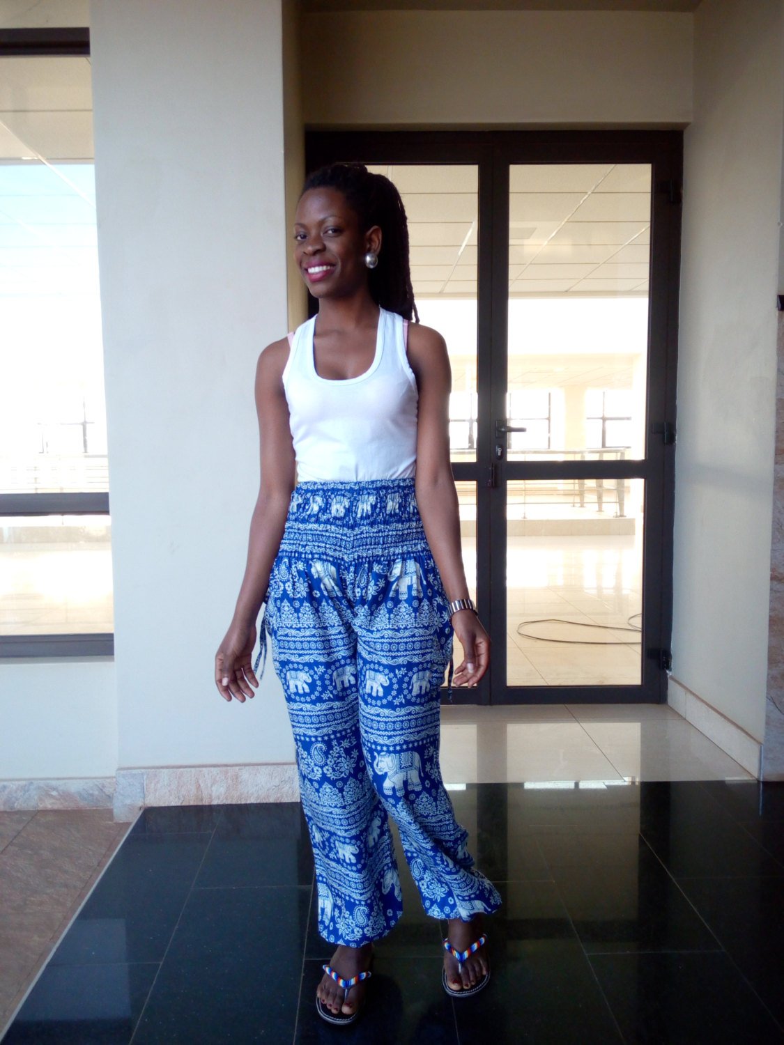 White Baobab high waist animal African print T-shirt featuring vibrant, colorful animal patterns on soft fabric.