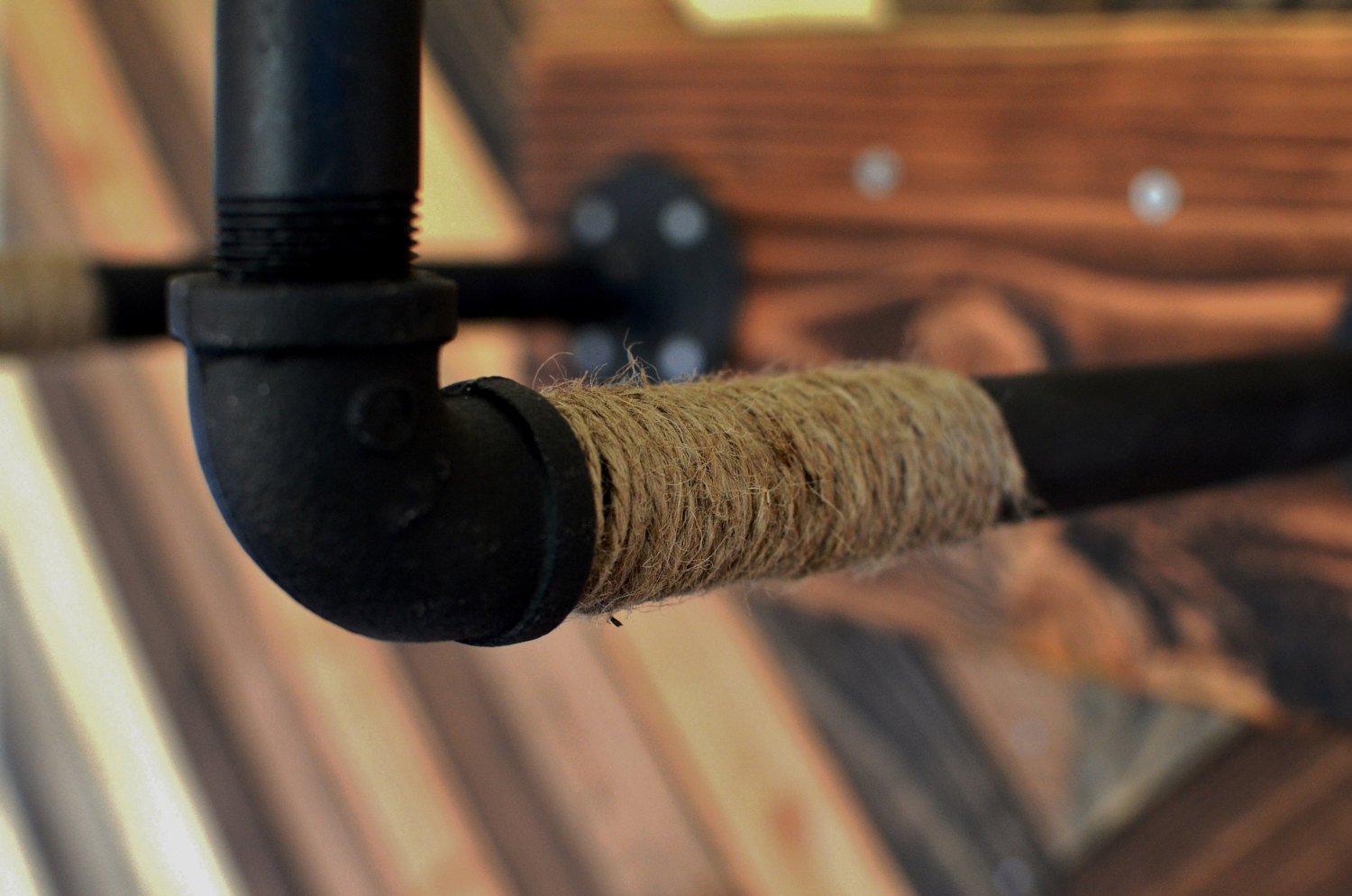 Burlap Iron Pipe Bicycle wall display from Pinwheel, perfect for home and garden decor, featuring rustic bicycle design on burlap background.