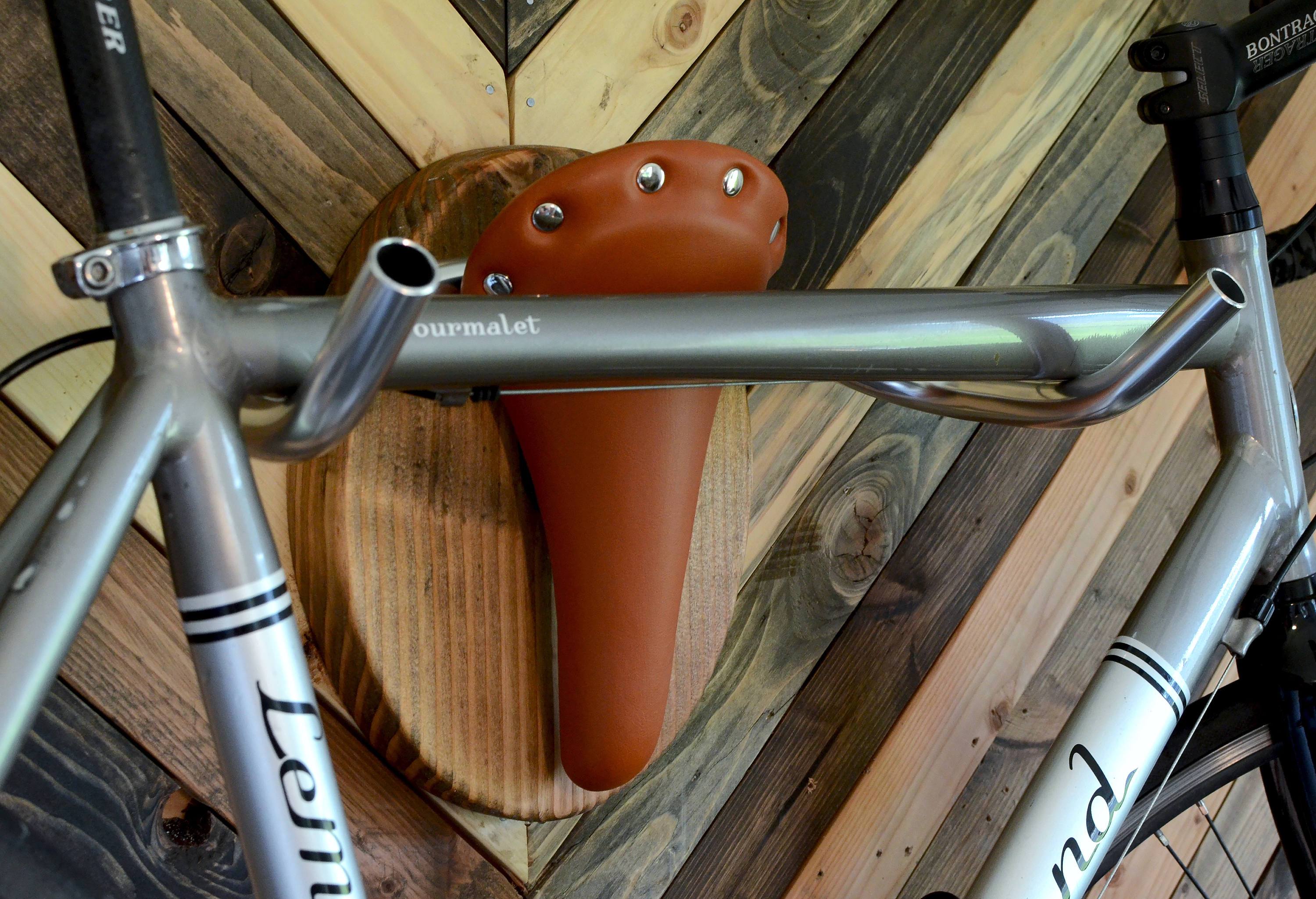 Decorative bike rack featuring a Longhorn steer taxidermy design by Pinwheel, for stylish home and garden use.