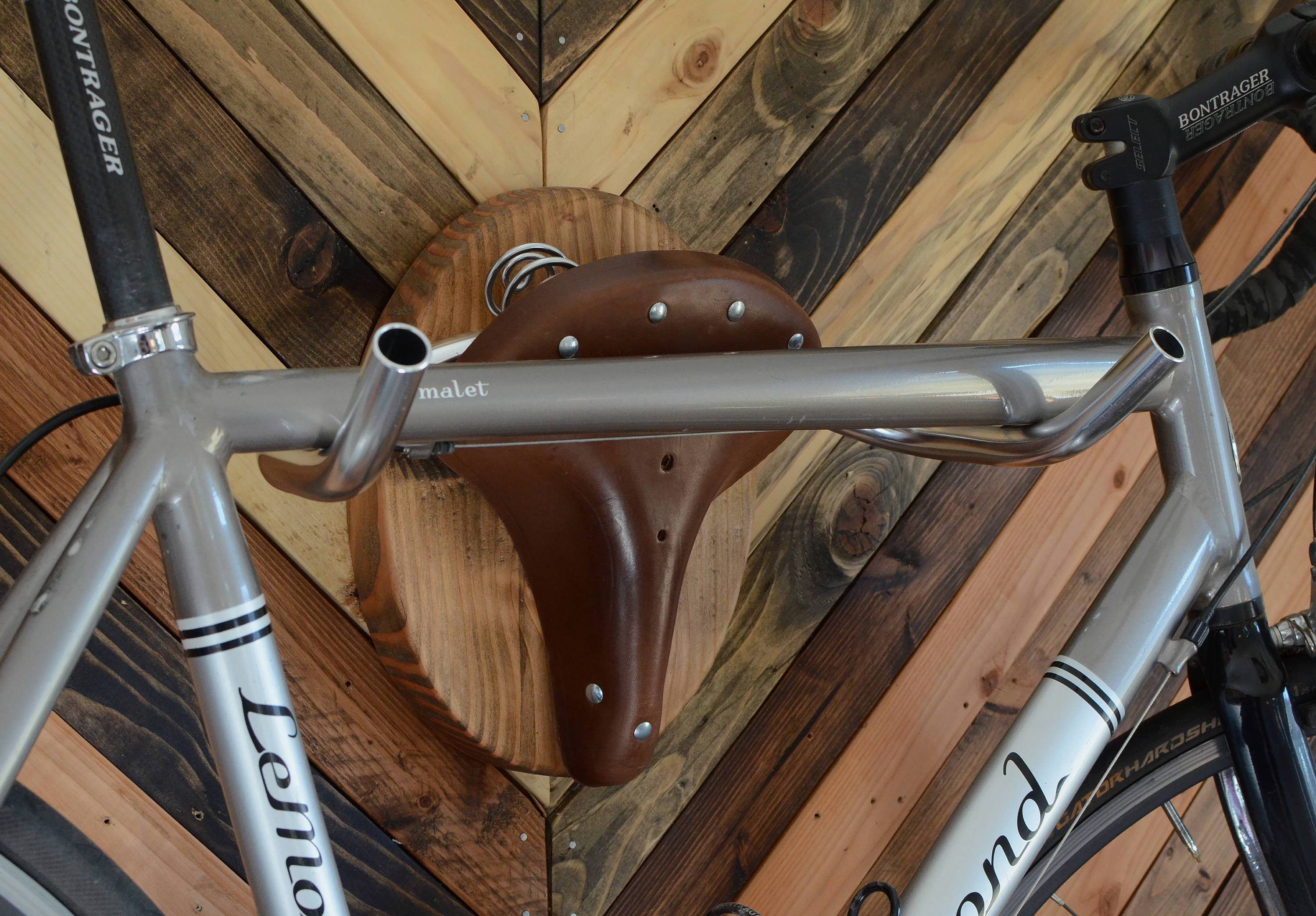 Pinwheel American bicycle taxidermy cycle rack for home decor, featuring vintage-style mounted bicycle design.