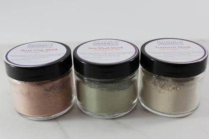White Smokey clay face mask trio featuring rose, French green, and kaolin clay with turmeric, displayed in white bowls.