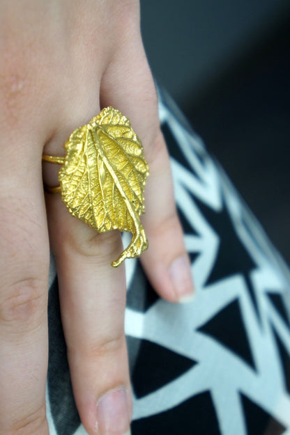 Handmade gold-plated sterling silver leaf ring from Beige Briseis, featuring intricate nature-inspired leaf design.