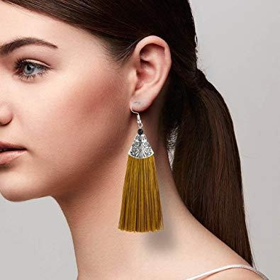 White Baobab tropical tassel African drop earrings with colorful thread, hanging elegantly with intricate details.