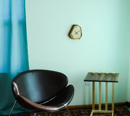 Pinwheel geometric wall and table clock, modern home decor piece with a sleek, angular design in a stylish geometric pattern.