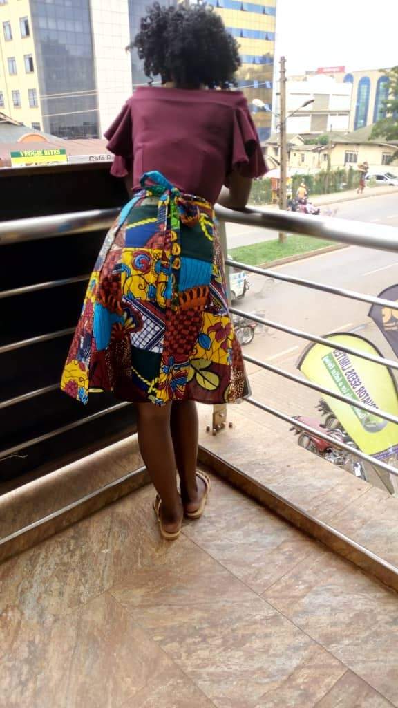 African Vintage Kitenge wrap mini skirt by White Baobab, featuring colorful traditional fabric and a stylish wrap design.
