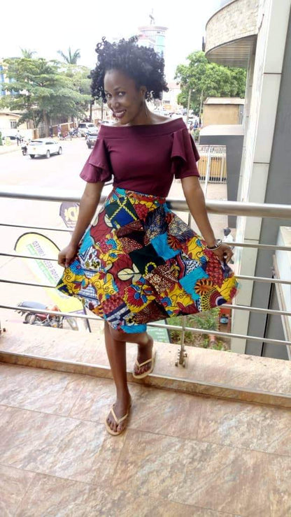African vintage Kitenge wrap mini skirt by White Baobab, featuring colorful patterned fabric and a stylish wrap design.