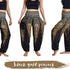 High waist peacock African boho pants from White Baobab, styled with a casual T-shirt, featuring vibrant patterns and relaxed fit.