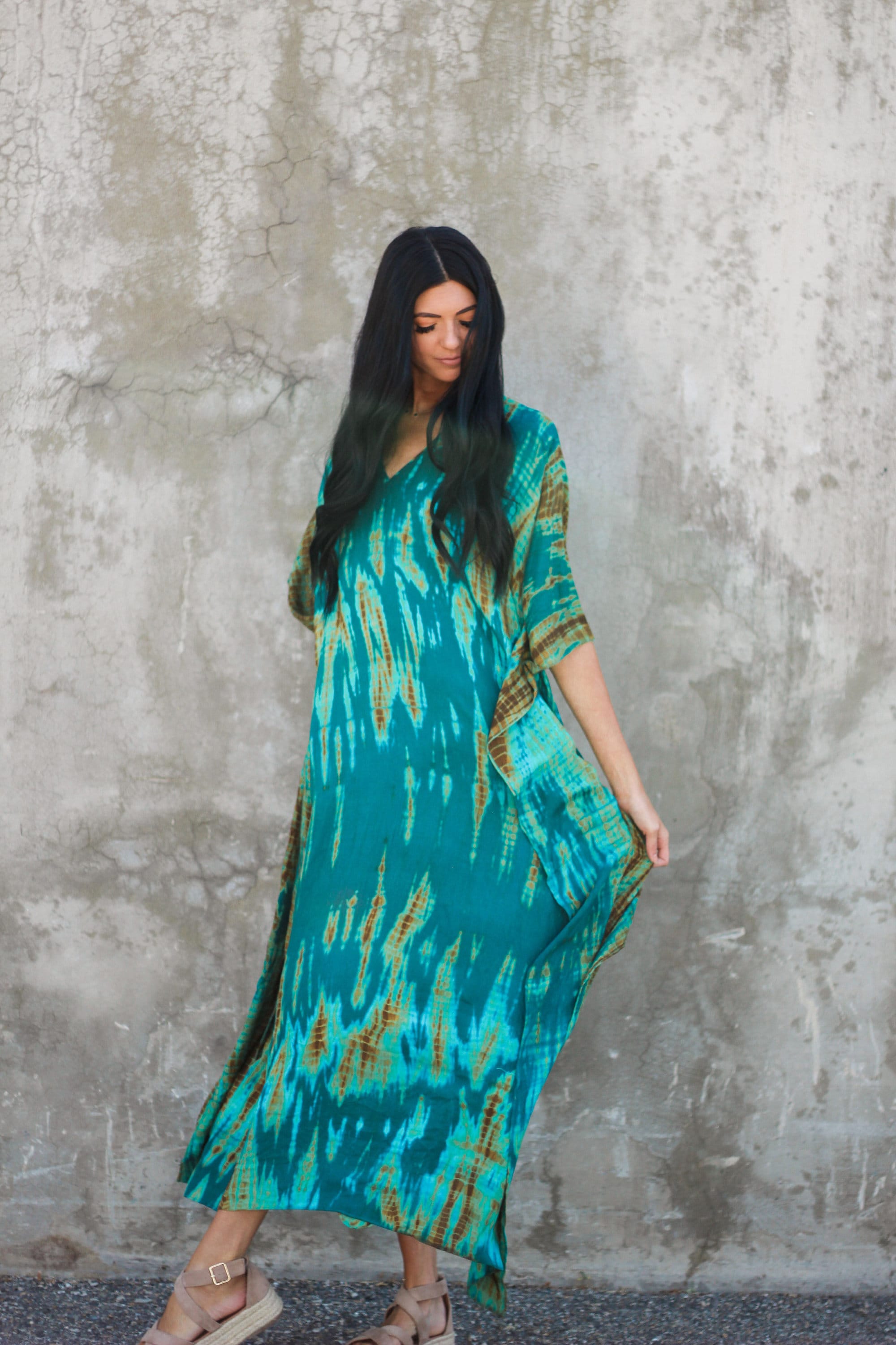 Plus size teal green tie-dyed kaftan dress with pockets by Erin Pontus, featuring a flowing fabric and relaxed fit.