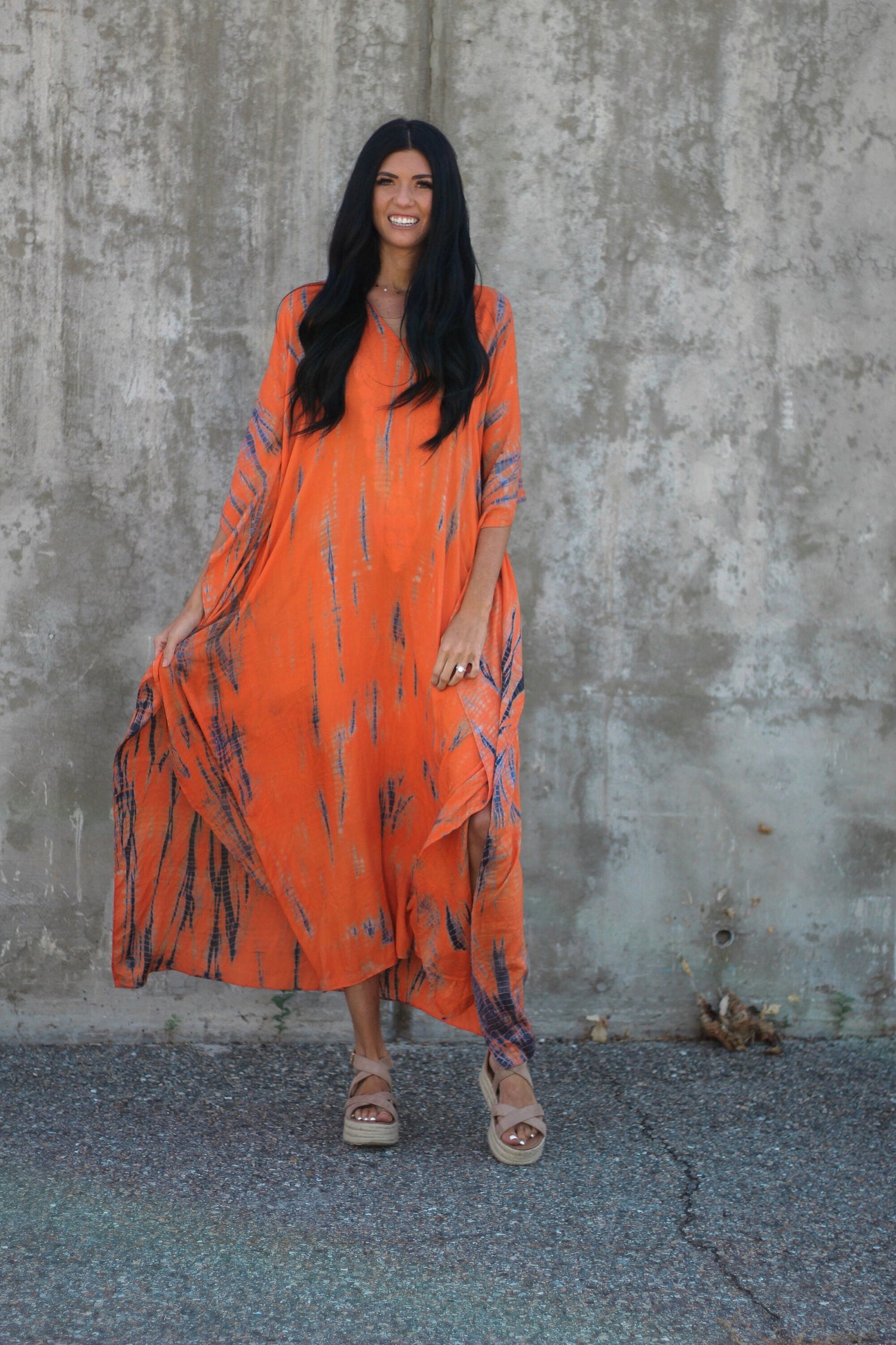 Orange tie-dye maxi kaftan dress by Erin Pontus with pockets, loose fit, hand-dyed, perfect for casual or beach wear.