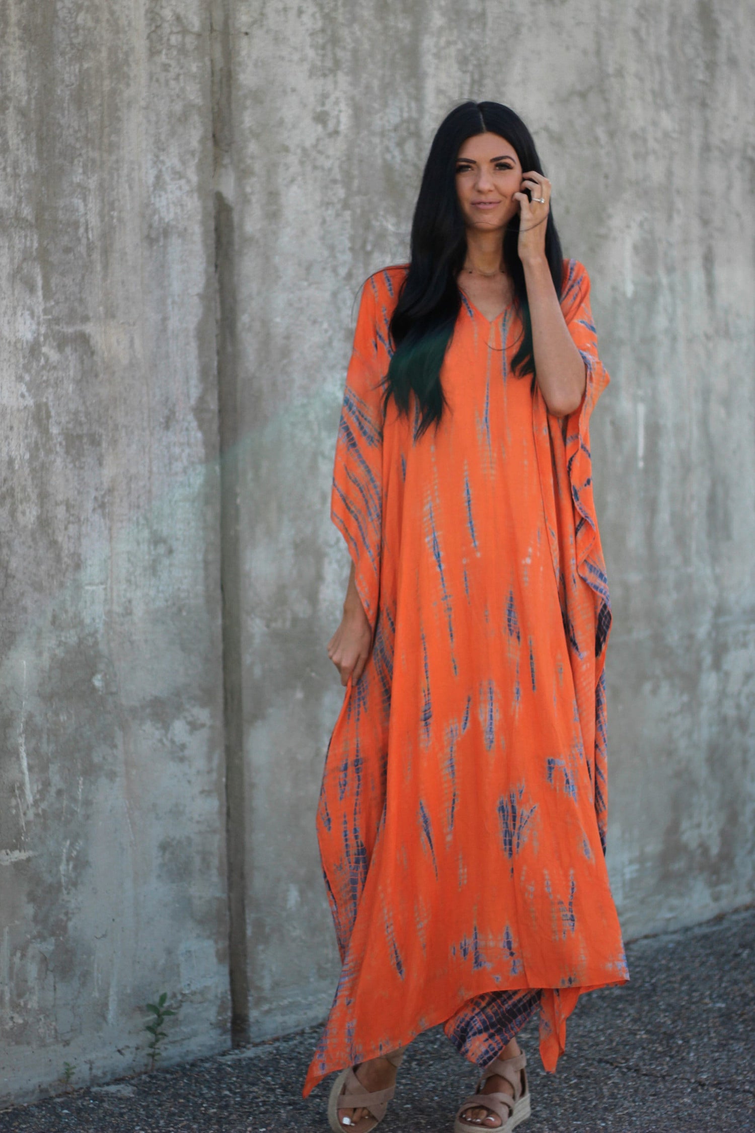 Hand-dyed orange tie-dye maxi kaftan dress with pockets by Erin Pontus, loose fit, flowing fabric, perfect for casual or beachwear.