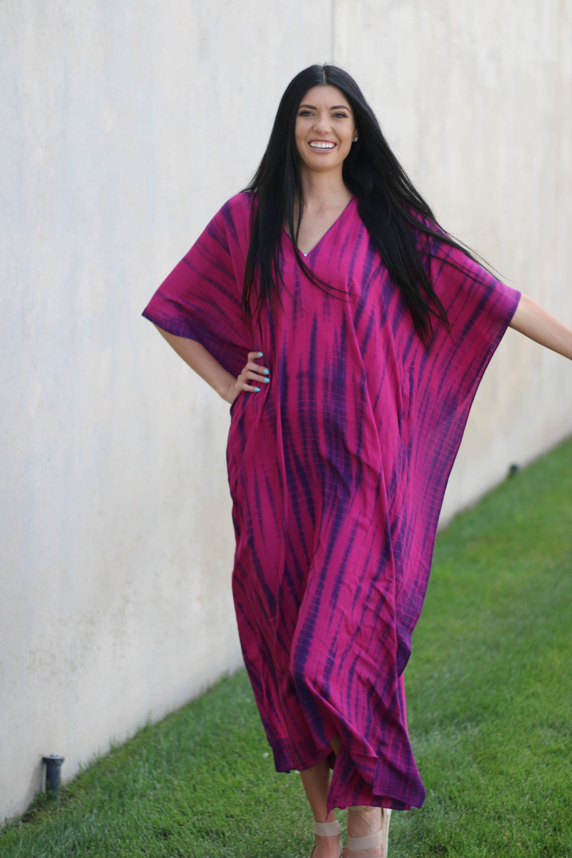 Plus size tie-dyed African and Indian kaftan dress by Erin Pontus, featuring vibrant colors and flowing fabric.