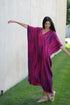 Plus size tie-dyed kaftan dress by Erin Pontus featuring vibrant African and Indian-inspired patterns and flowing fabric.