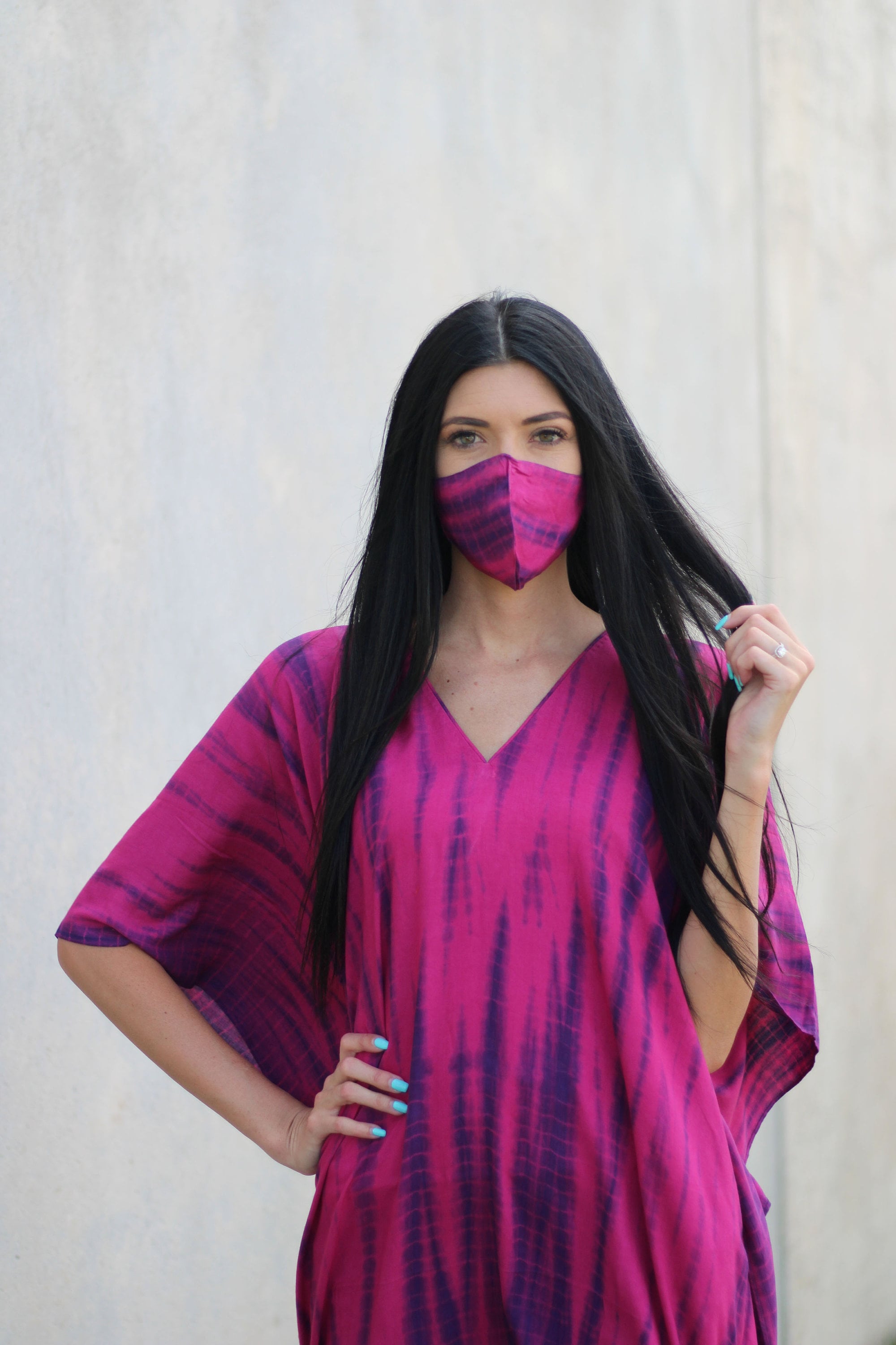 Plus size tie-dyed kaftan dress by Erin Pontus featuring vibrant African and Indian-inspired patterns and flowing fabric.