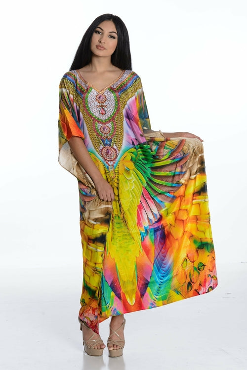 Plus size Mexican maxi kaftan dress by Erin Pontus, flowing boho-style dress for women with vibrant, colorful fabric.