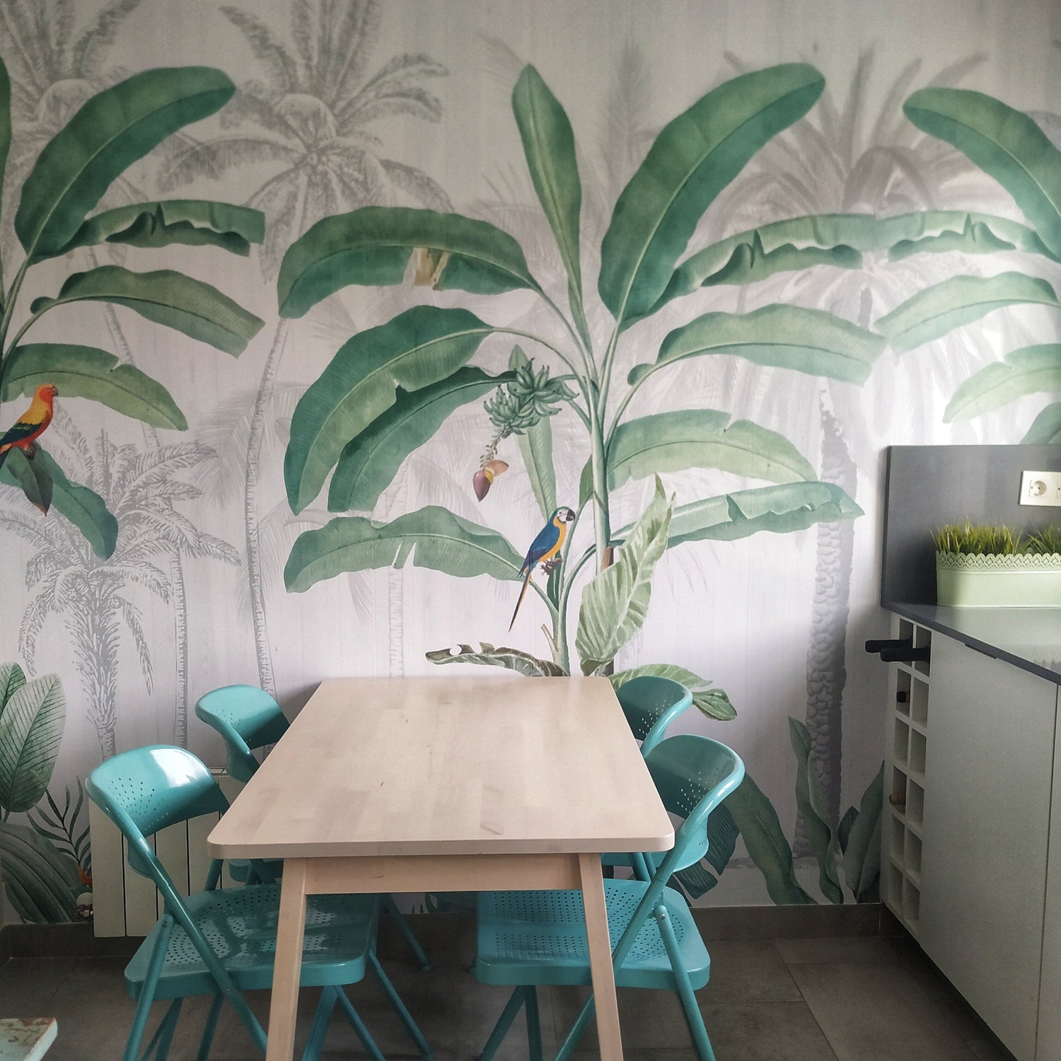 Green Tulsi tropical jungle wallpaper mural featuring lush green leaves and vibrant jungle scenery for home decor.