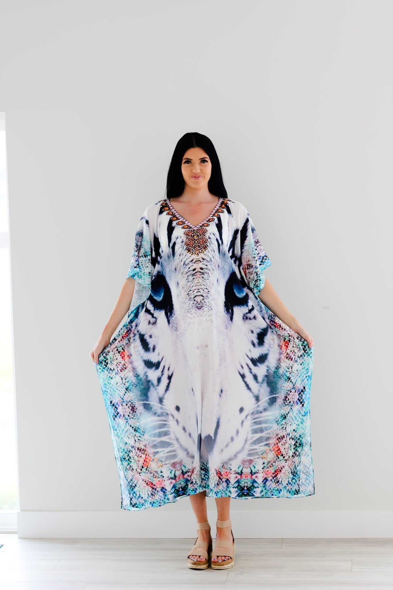 Plus size Tribal Kaftan dress by Erin Pontus featuring intricate embellishments and flowing fabric, perfect for stylish occasions.
