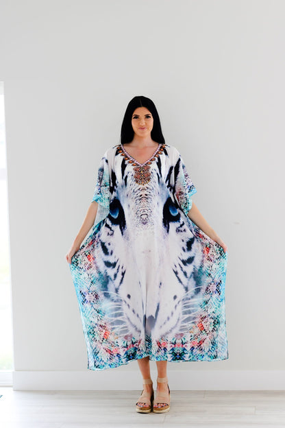 Plus size Tribal Kaftan dress by Erin Pontus featuring intricate embellishments and flowing fabric, perfect for stylish occasions.