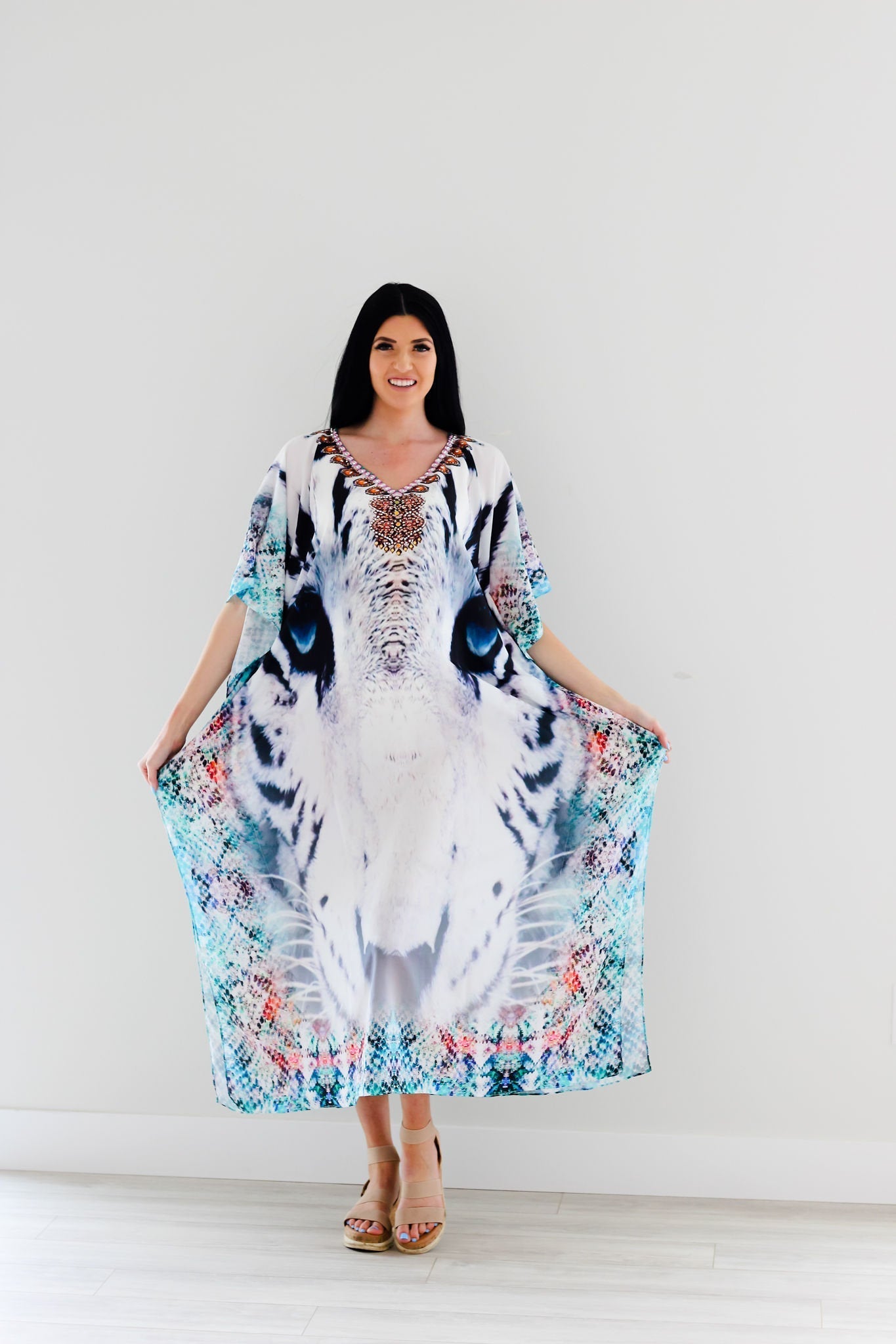 Plus size Tribal Kaftan Dress by Erin Pontus with embellished details, flowing fabric, and intricate tribal patterns.