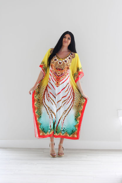 Traditional tribal kaftan dress by Erin Pontus featuring vibrant African-inspired patterns and flowing fabric for a bohemian look.
