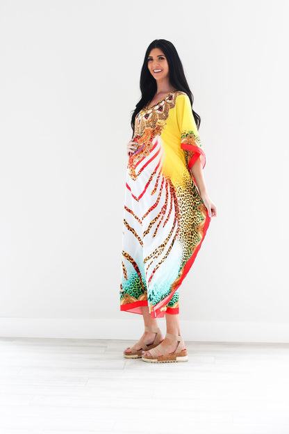Traditional African tribal kaftan dress by Erin Pontus, featuring vibrant patterns and flowing fabric, perfect for cultural or casual wear.