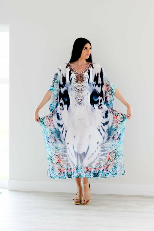 Plus size Tribal Kaftan Dress by Erin Pontus with embellished details, flowing fabric, and vibrant tribal-inspired pattern.