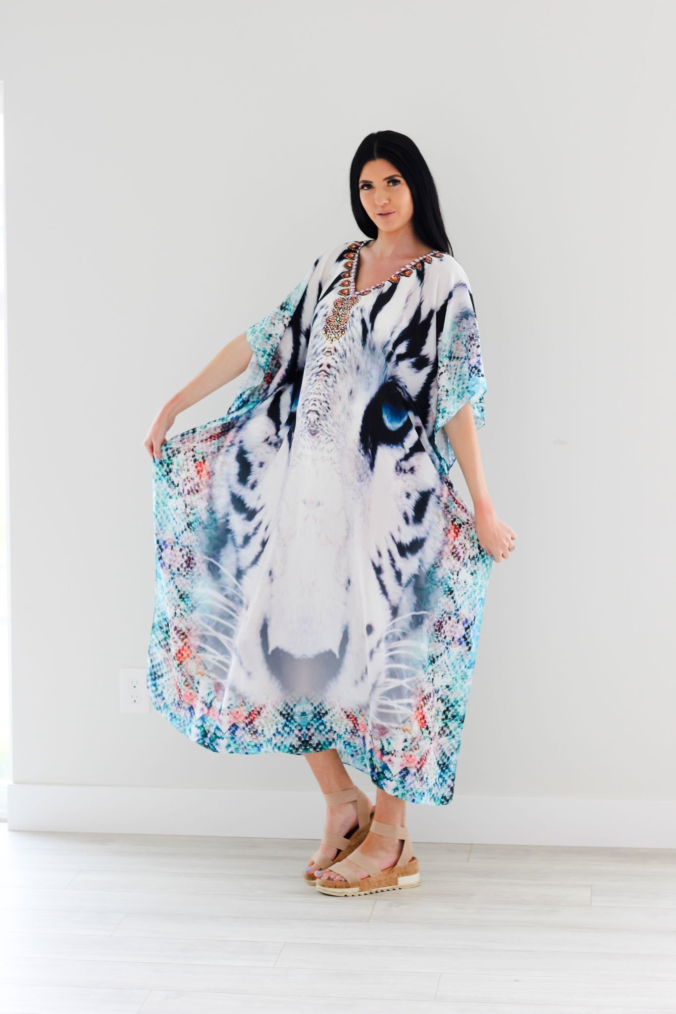 Plus size Tribal Kaftan Dress by Erin Pontus with embellished details, featuring vibrant patterns and flowing fabric for a stylish look.