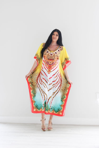 Traditional African tribal kaftan dress by Erin Pontus, featuring vibrant patterns and flowing fabric, perfect for stylish occasions.