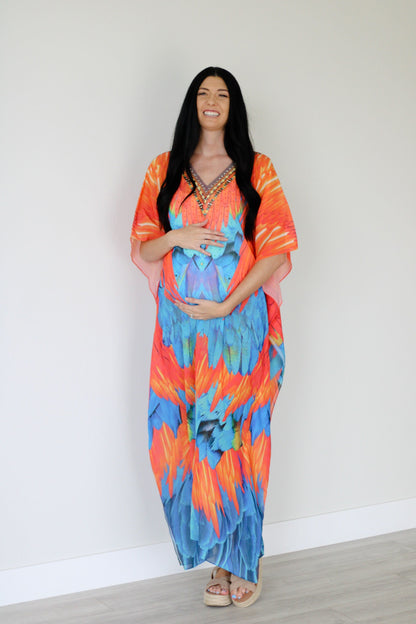 Plus size tribal feather kaftan dress by Erin Pontus featuring vibrant patterns and flowing fabric for women.