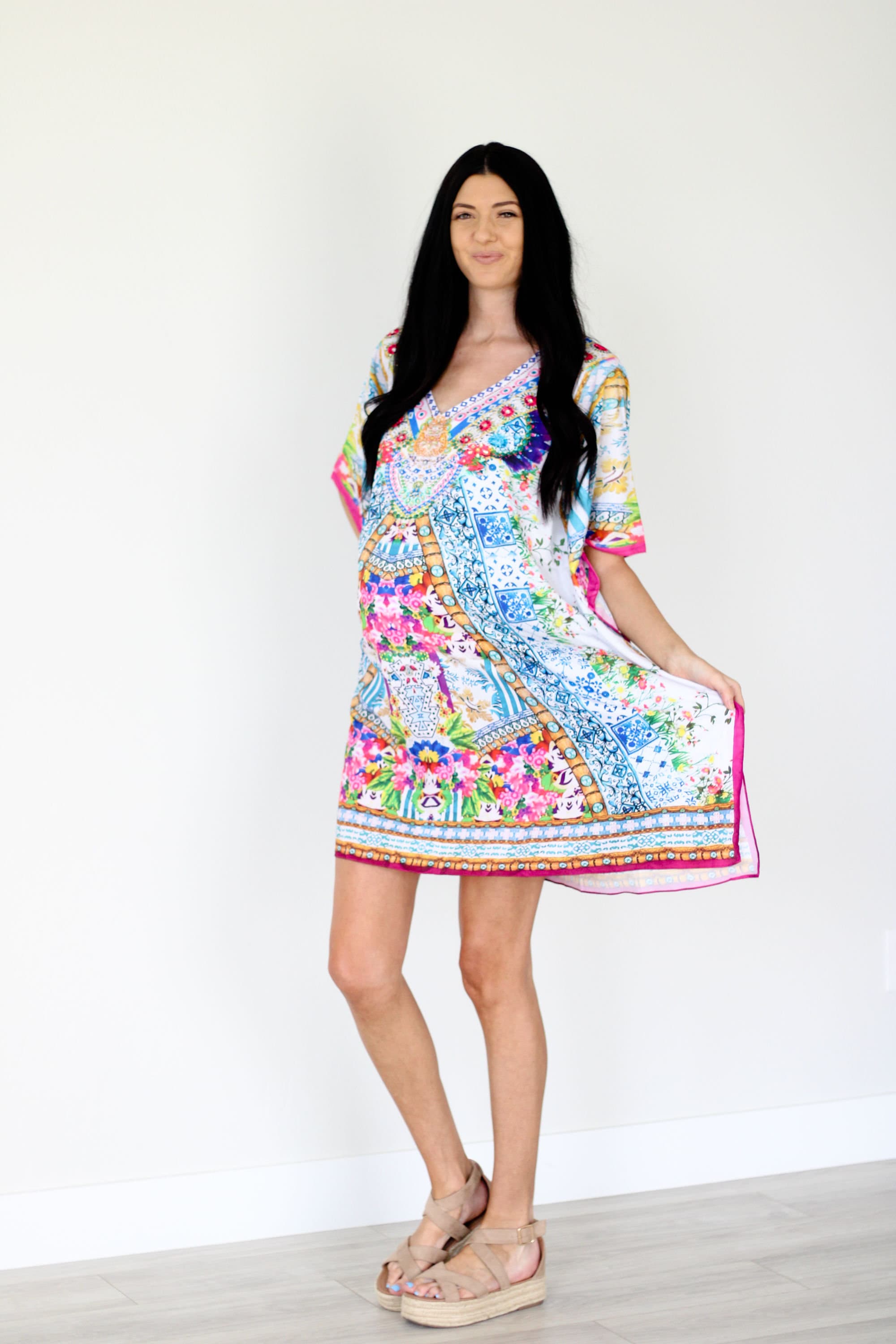Plus size traditional tribal caftan dress by Erin Pontus featuring colorful patterns and flowing fabric, perfect for casual or special occasions.