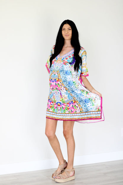 Plus size traditional tribal caftan dress by Erin Pontus featuring colorful patterns and flowing fabric, perfect for casual or special occasions.