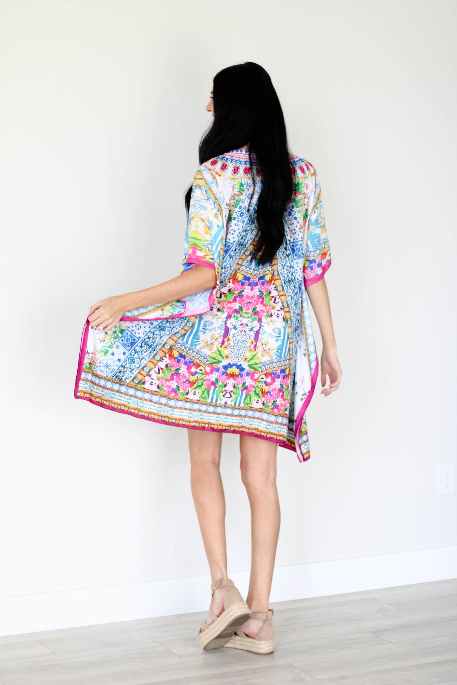 Plus size traditional tribal kaftan dress by Erin Pontus, featuring vibrant patterns and flowing fabric.