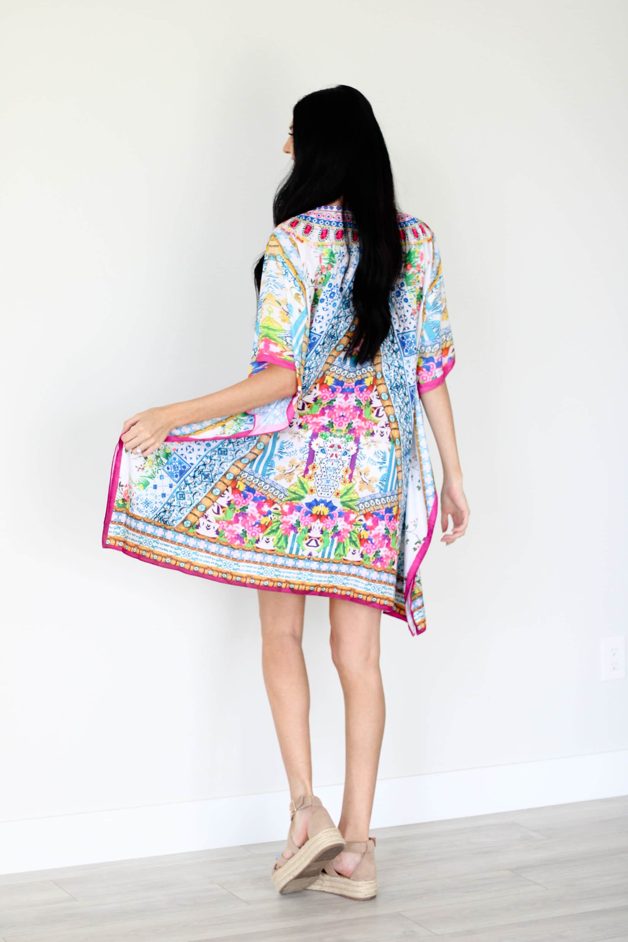 Plus size traditional tribal kaftan dress by Erin Pontus, featuring vibrant patterns and flowing fabric.