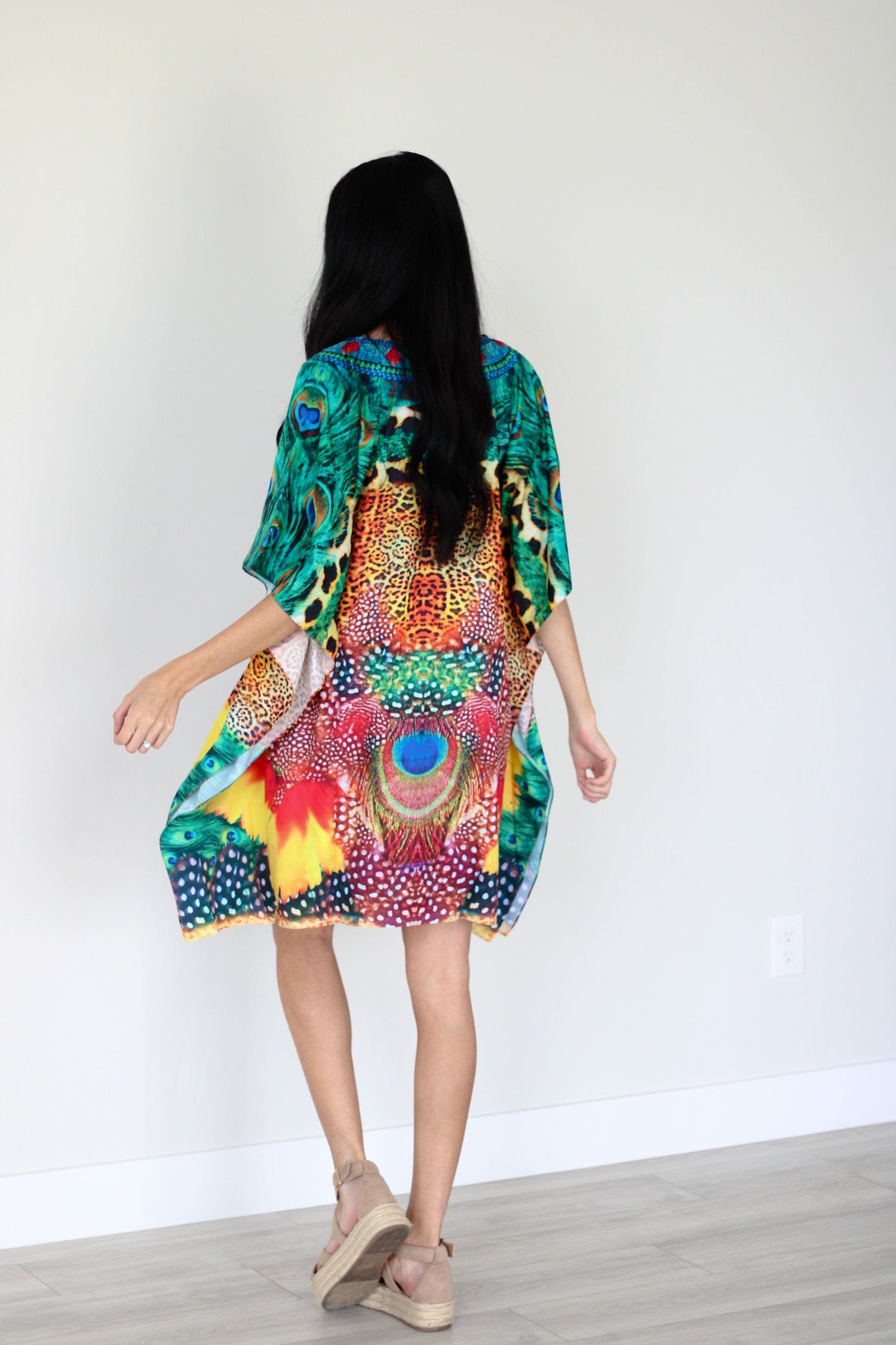 Plus size tropical kaftan dress by Erin Pontus, featuring colorful African-inspired midi design with flowing fabric.