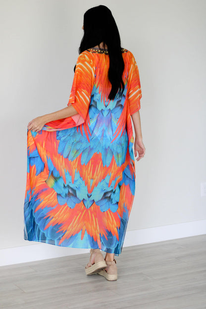 Plus size tribal feather kaftan dress by Erin Pontus, flowing fabric and vibrant patterns for a stylish, comfortable look.