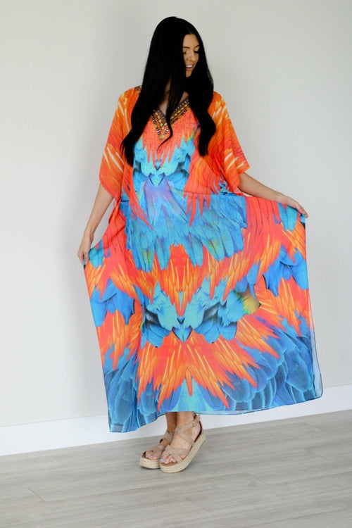 Plus size tribal feather caftan dress by Erin Pontus featuring vibrant patterns and flowing fabric for a stylish boho look