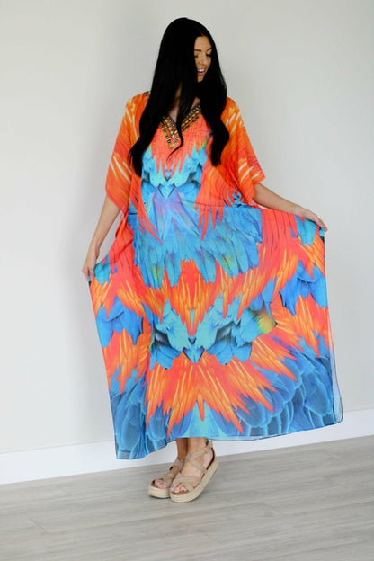 Plus size tribal feather caftan dress by Erin Pontus featuring vibrant patterns and flowing fabric for a stylish boho look