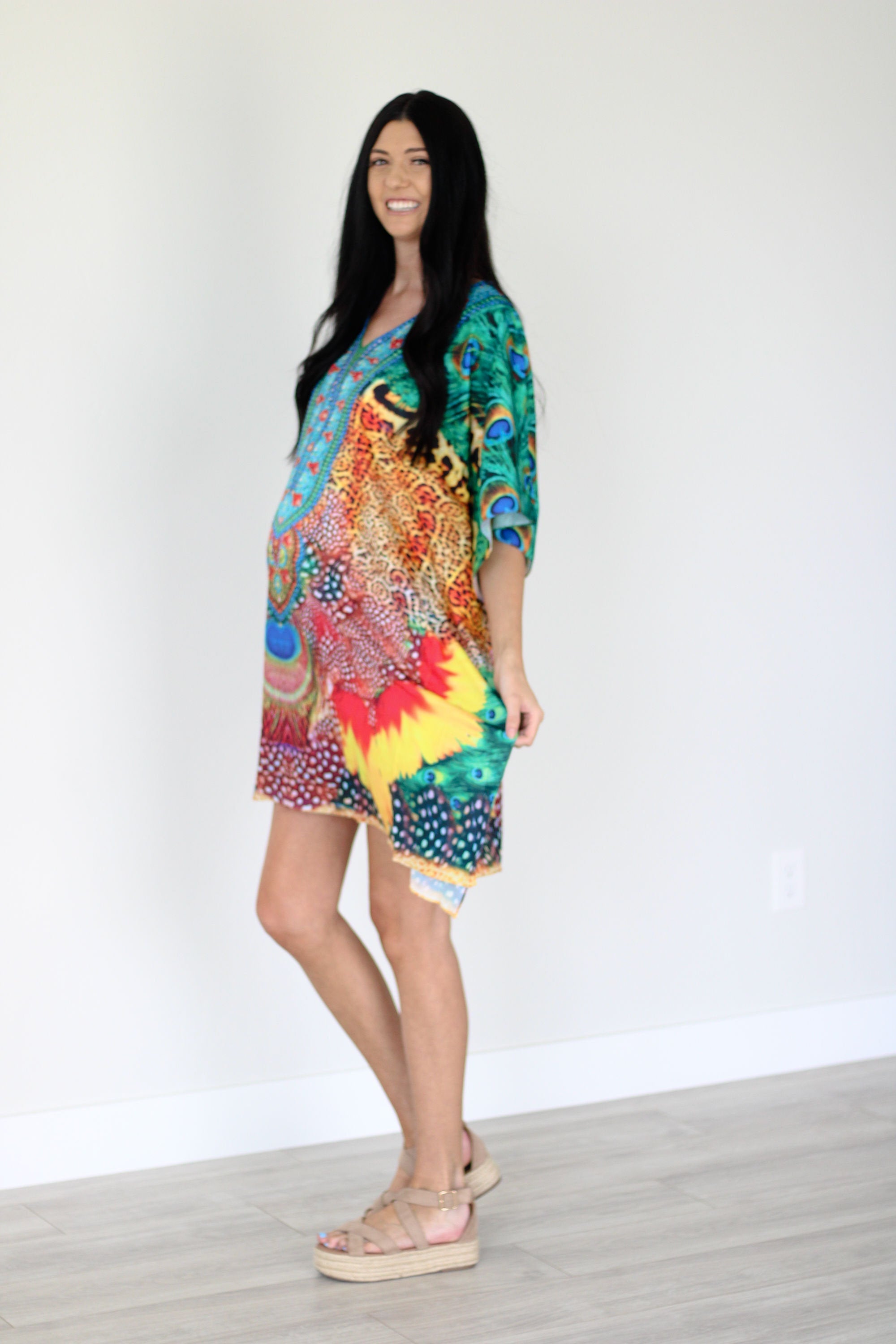 Plus size tropical kaftan dress by Erin Pontus featuring vibrant African-inspired prints and a flowing midi design.