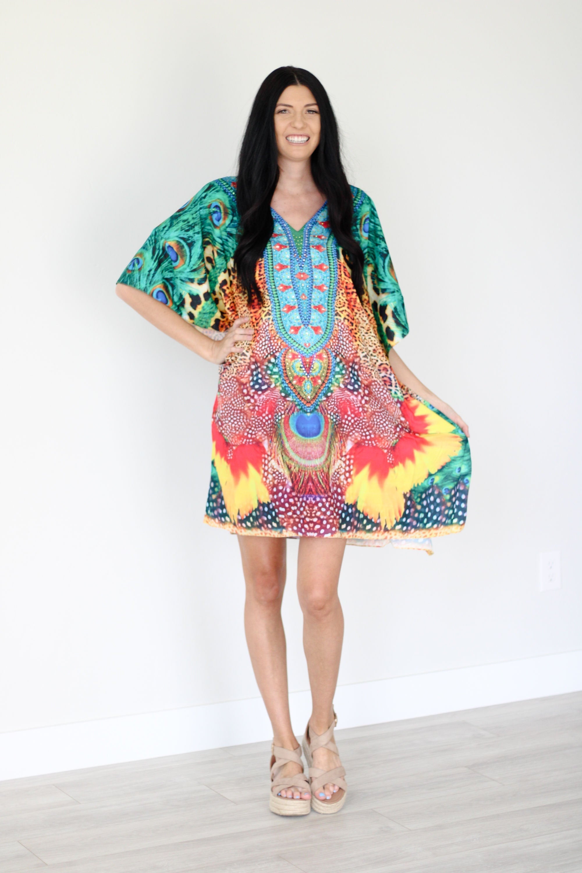 Plus size tropical kaftan dress by Erin Pontus featuring vibrant African-inspired midi design, flowing fabric and colorful patterns.