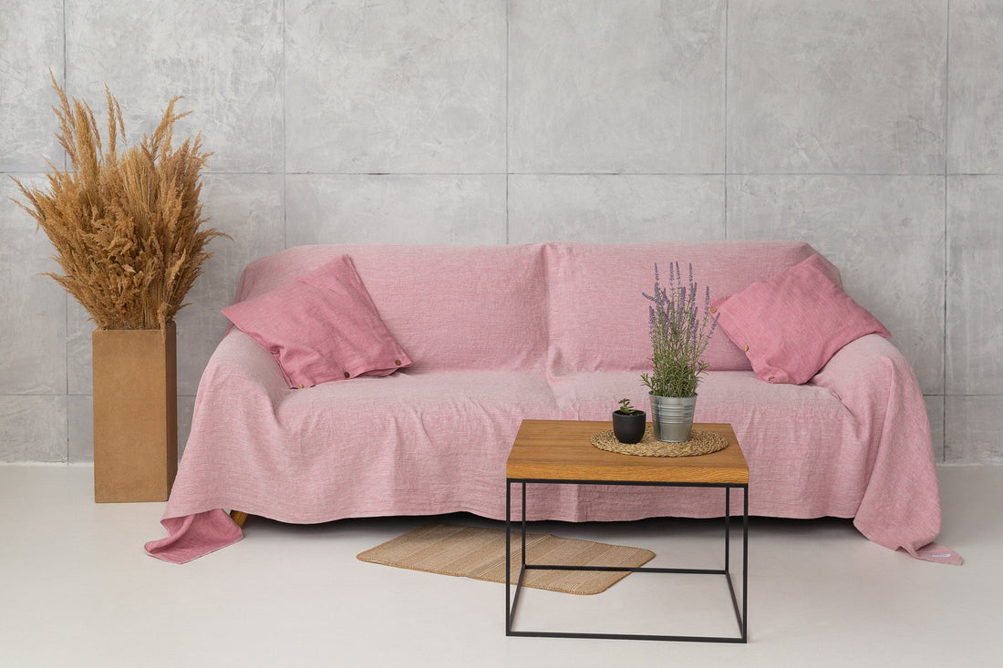 Magenta Sugarplum Woodrose linen couch cover draped over a sofa, showcasing soft, textured home decor for a stylish living space.
