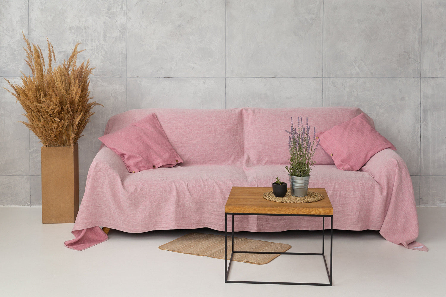 Magenta Sugarplum Woodrose linen couch cover draped over a sofa, showcasing soft, textured home decor for a stylish living space.