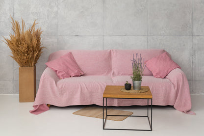 Magenta Sugarplum Woodrose linen couch cover draped over a sofa, showcasing soft, textured home decor for a stylish living space.