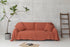 Reddish brown linen couch cover by Magenta Sugarplum, stylish home decor fabric draped over a sofa.