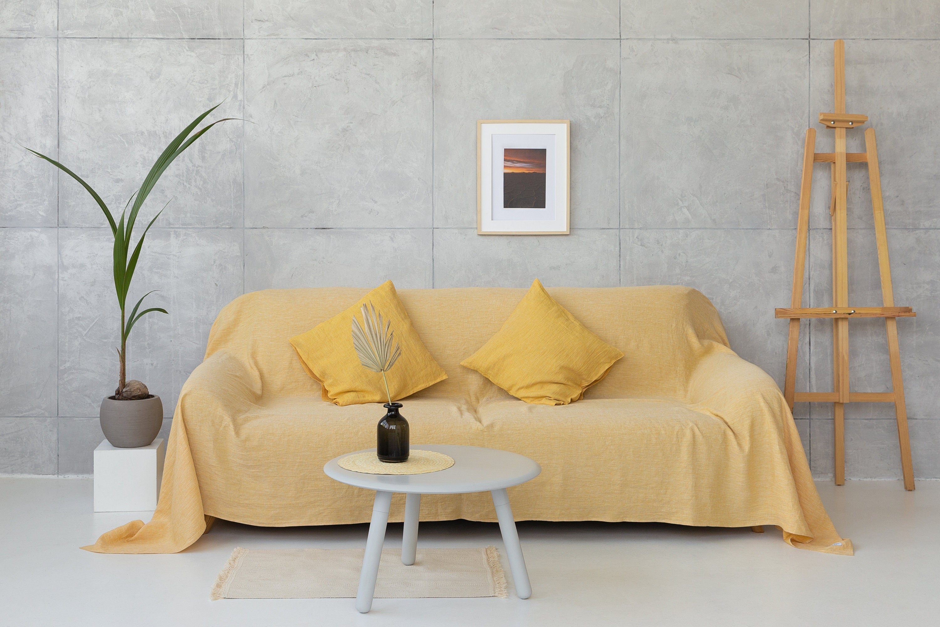 Reddish brown linen couch cover by Magenta Sugarplum, stylish home decor for sofa protection and aesthetic enhancement.