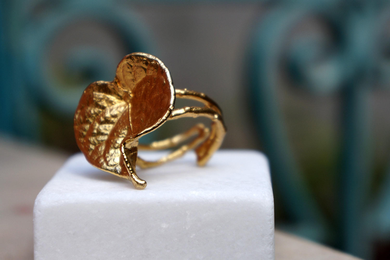 Gold-plated brass Forest Leaf ring with adjustable band, botanical plant jewelry in a natural leaf design.