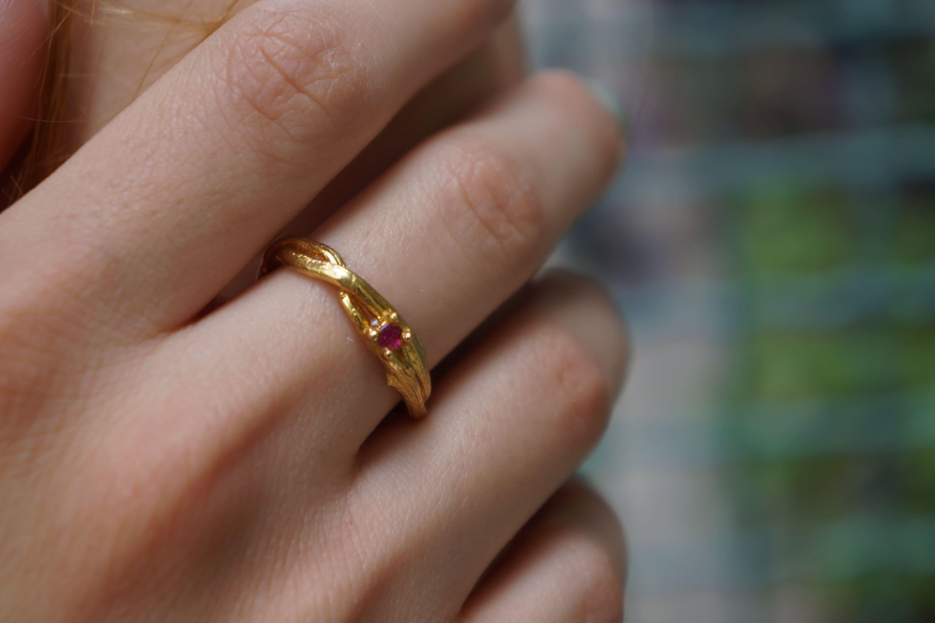 Gold and silver jewelry ring featuring an olive branch twig design from Beige Briseis, inspired by nature.