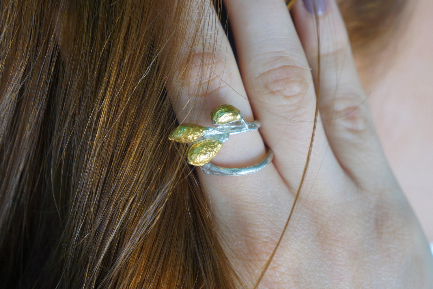 Sterling silver adjustable leaf ring with handmade olive branch design from Beige Briseis jewelry collection.