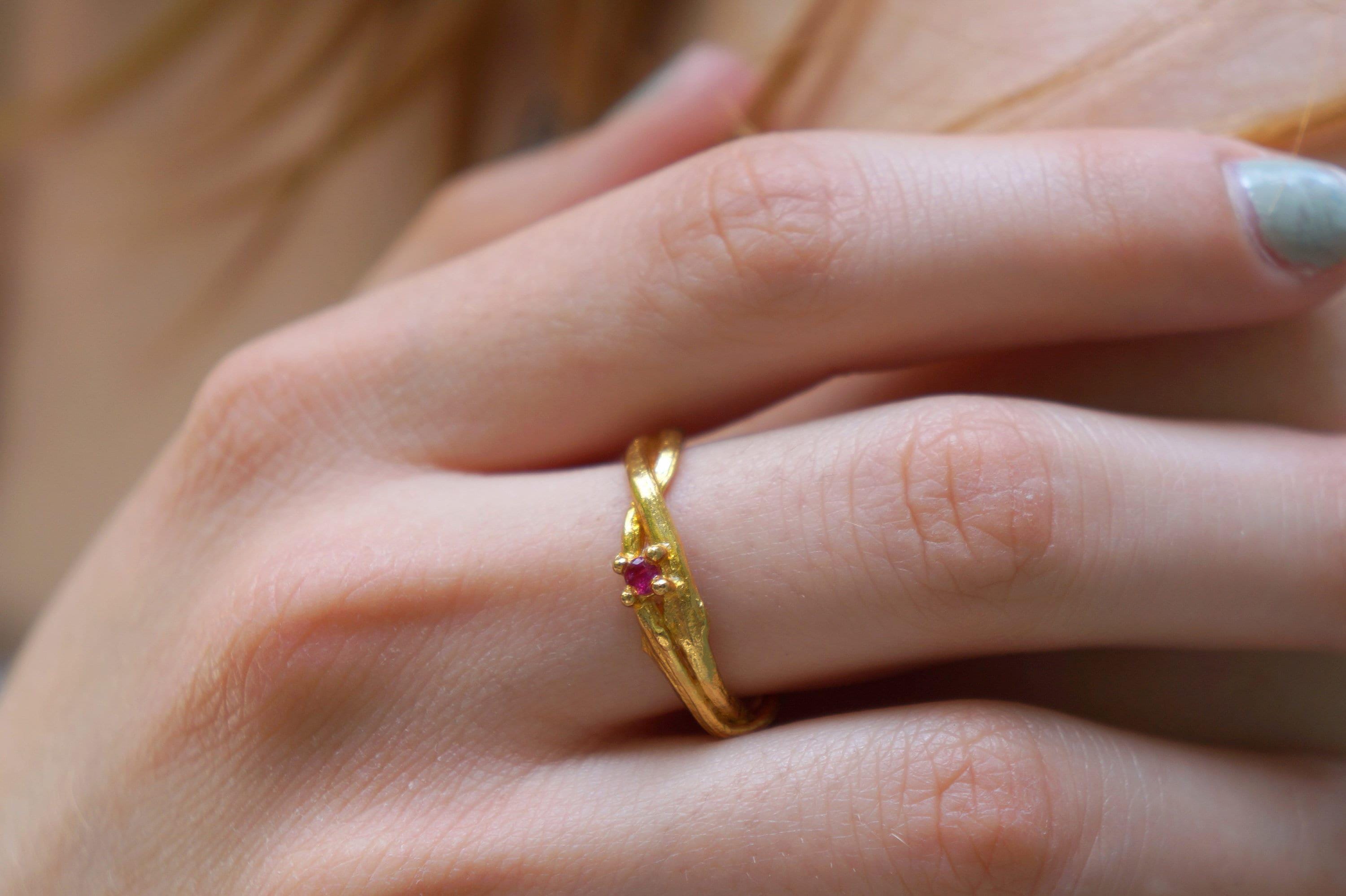 14k gold olive branch ring by Beige Briseis featuring a twig design on silver, inspired by nature and botanical motifs.