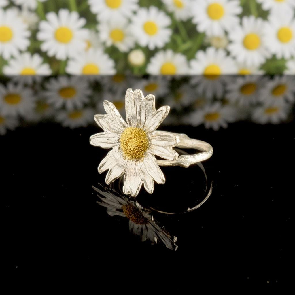 Handmade Daisy Ring with real flower set in recycled sterling silver, showcasing delicate floral jewelry design.