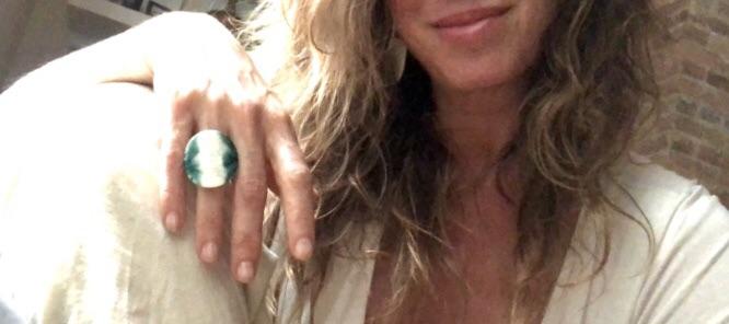 Adjustable handmade ceramic cocktail ring in teal by Azure Nesoi, featuring a bold statement jewelry design.
